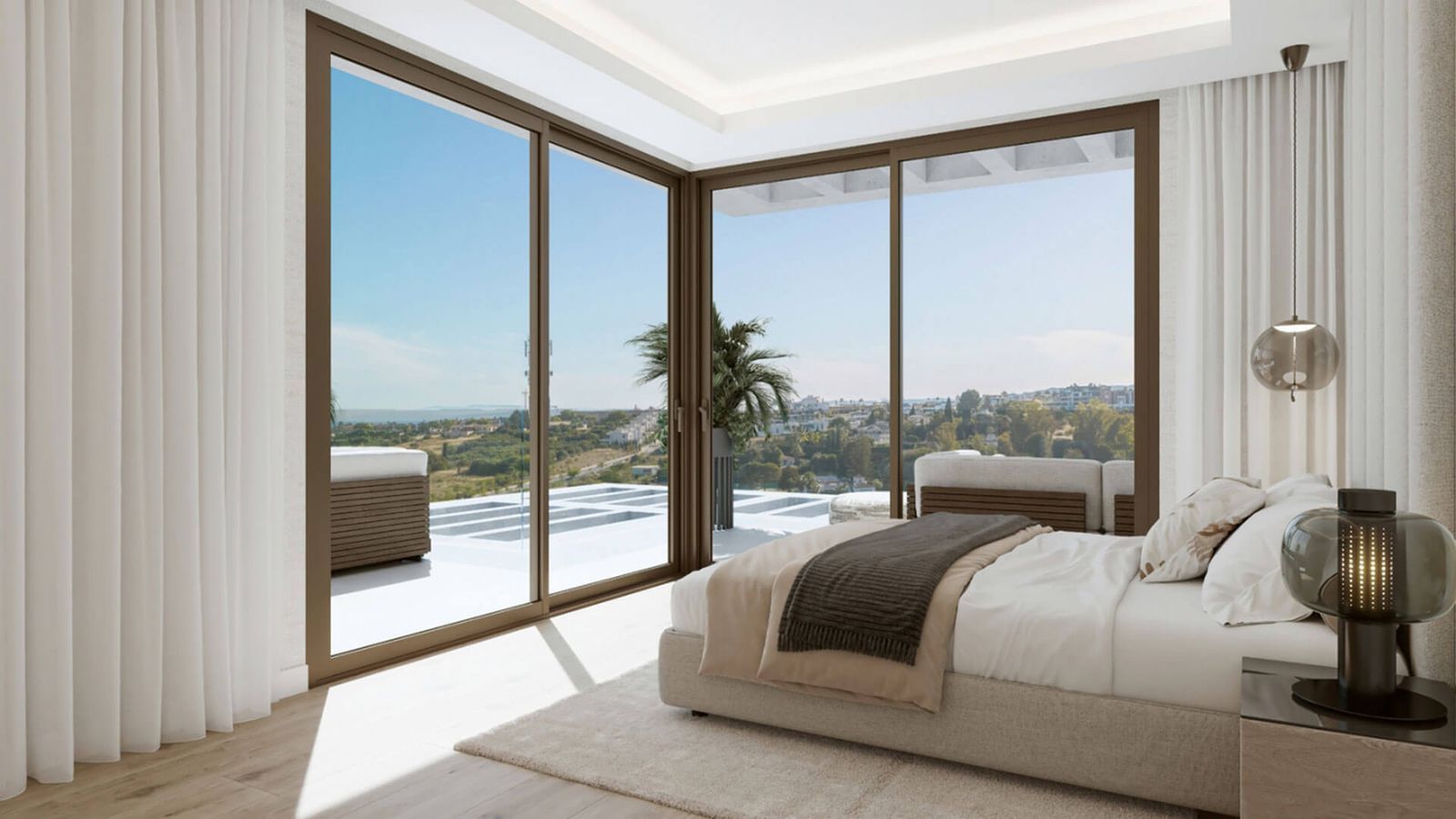 Dormitorio de lujo con vistas panorámicas al mar y a la ciudad en Taray Residences.